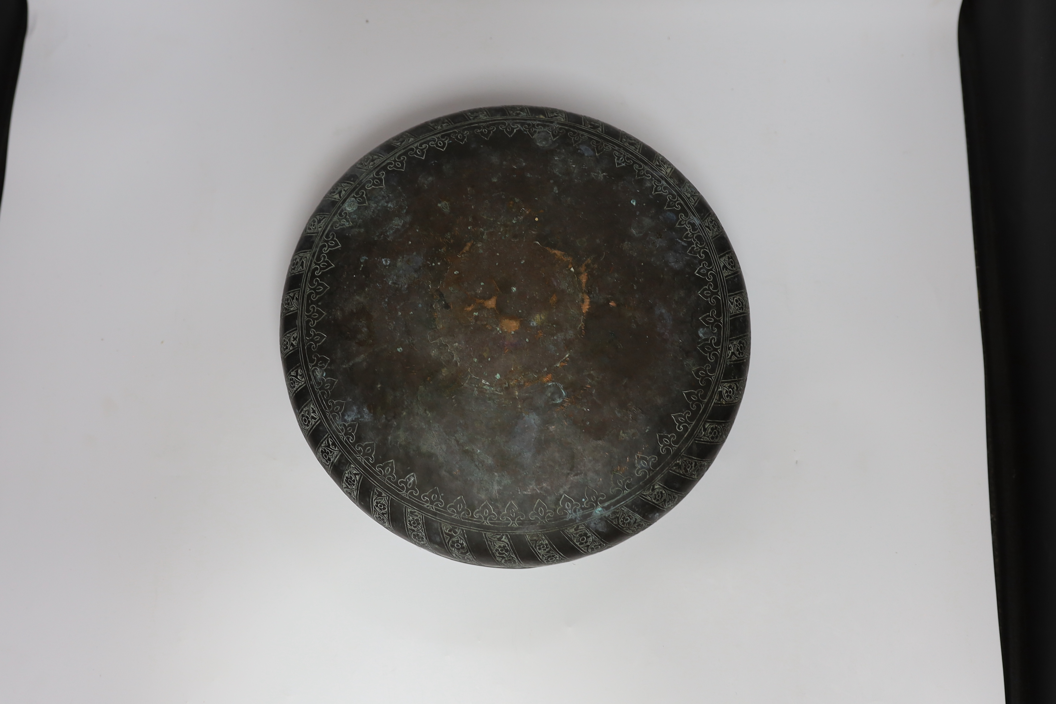 A Middle Eastern patinated copper bowl, 32cm diameter